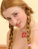 New nubile redhead in pigtails