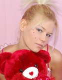 Private gwen plays with red teddy bear